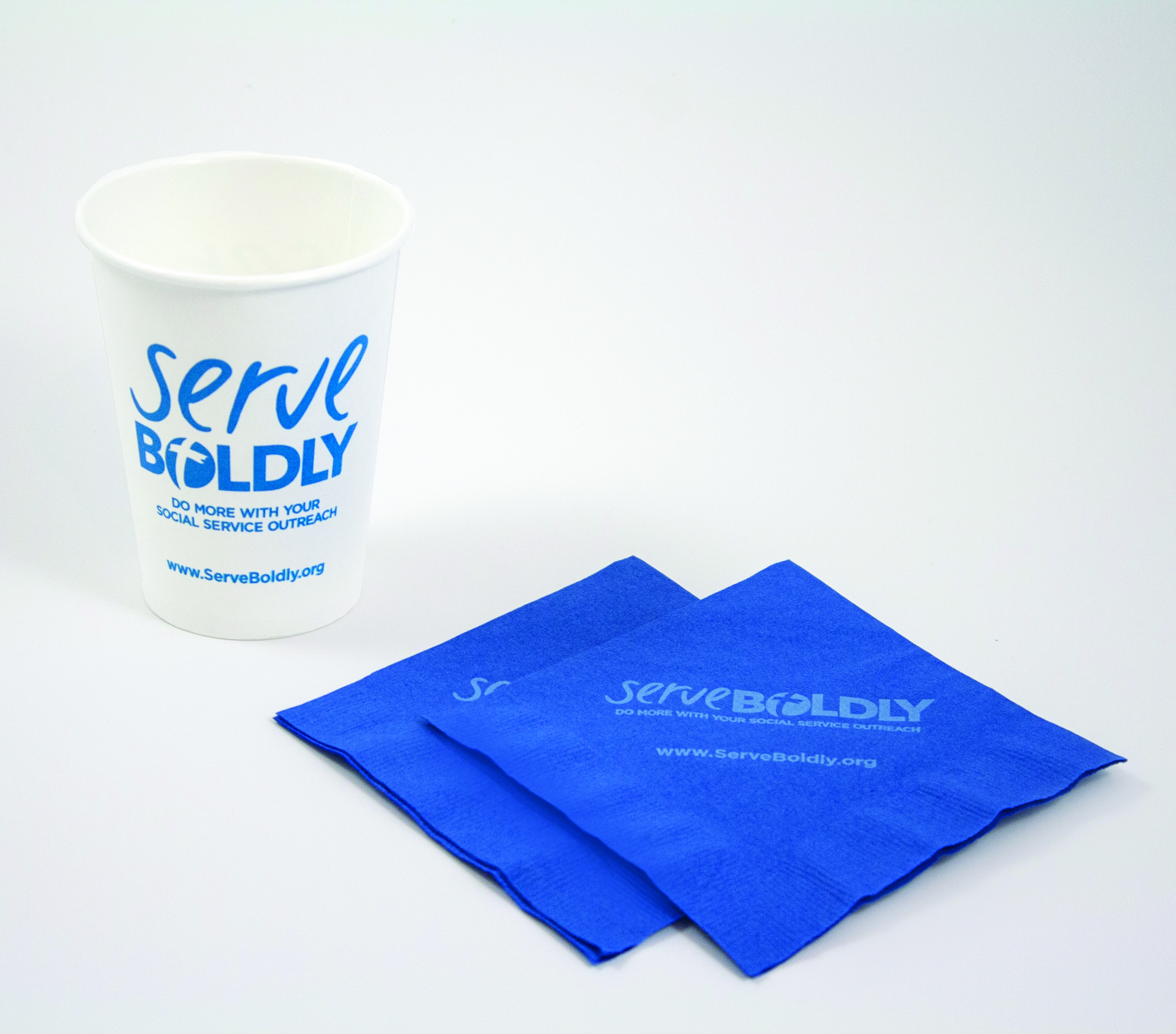 Serve Boldly napkins and cups with the logo