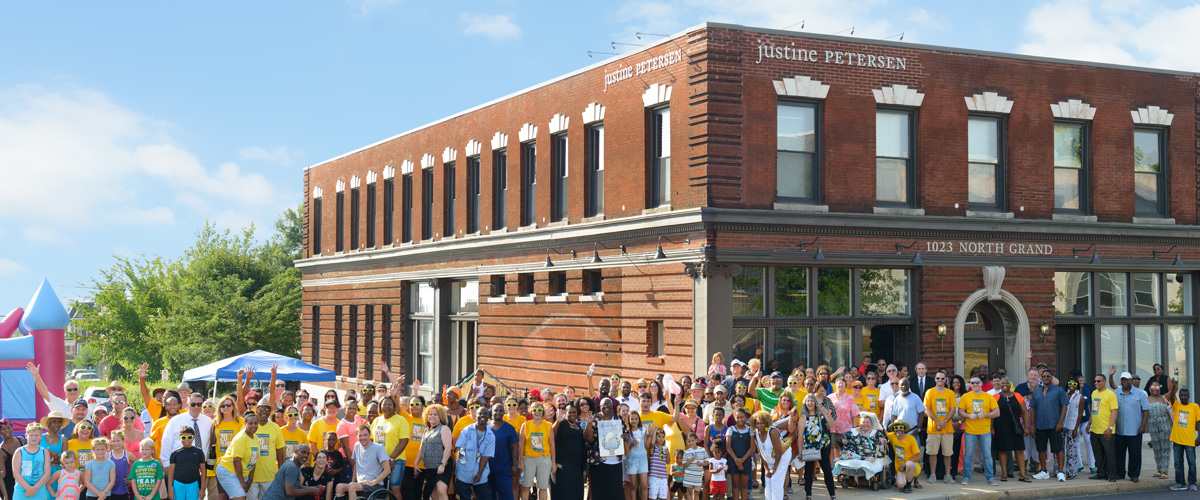 photo of a crowd of supporters outside the Justine Petersen building